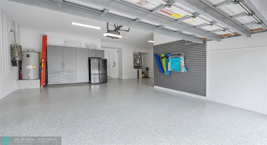 Brand New spacious 3 car Garage cabinetry installed by 
