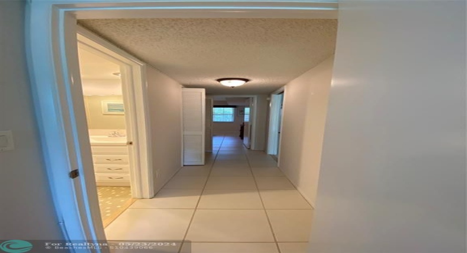 Hallway to 2nd Bedroom with Storage Closet