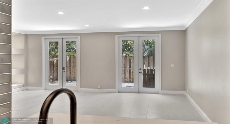 View of Living Room and Patio from Kitchen