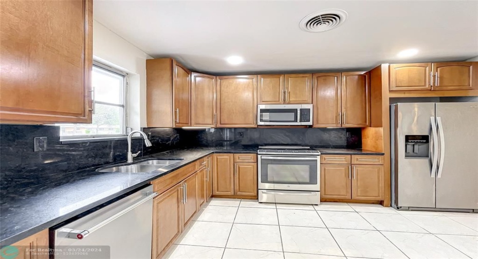 Open floor plan design, with plenty of room in kitchen for breakfast table and chairs