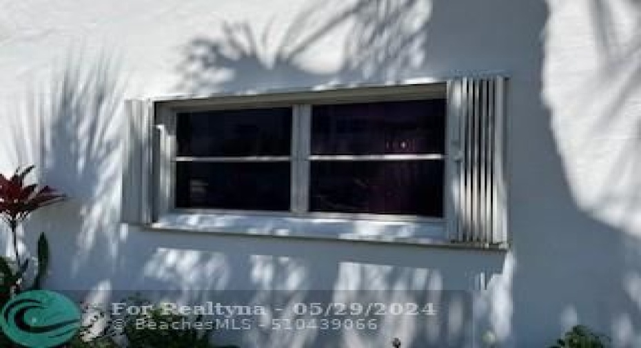 Hurricane shutter on window