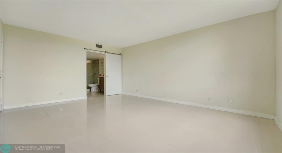 Rolling barn door to primary bath!