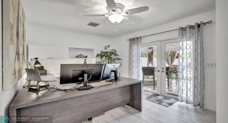 Currently used as home office with pool view