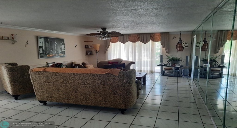 Spacious living room with crown moldings