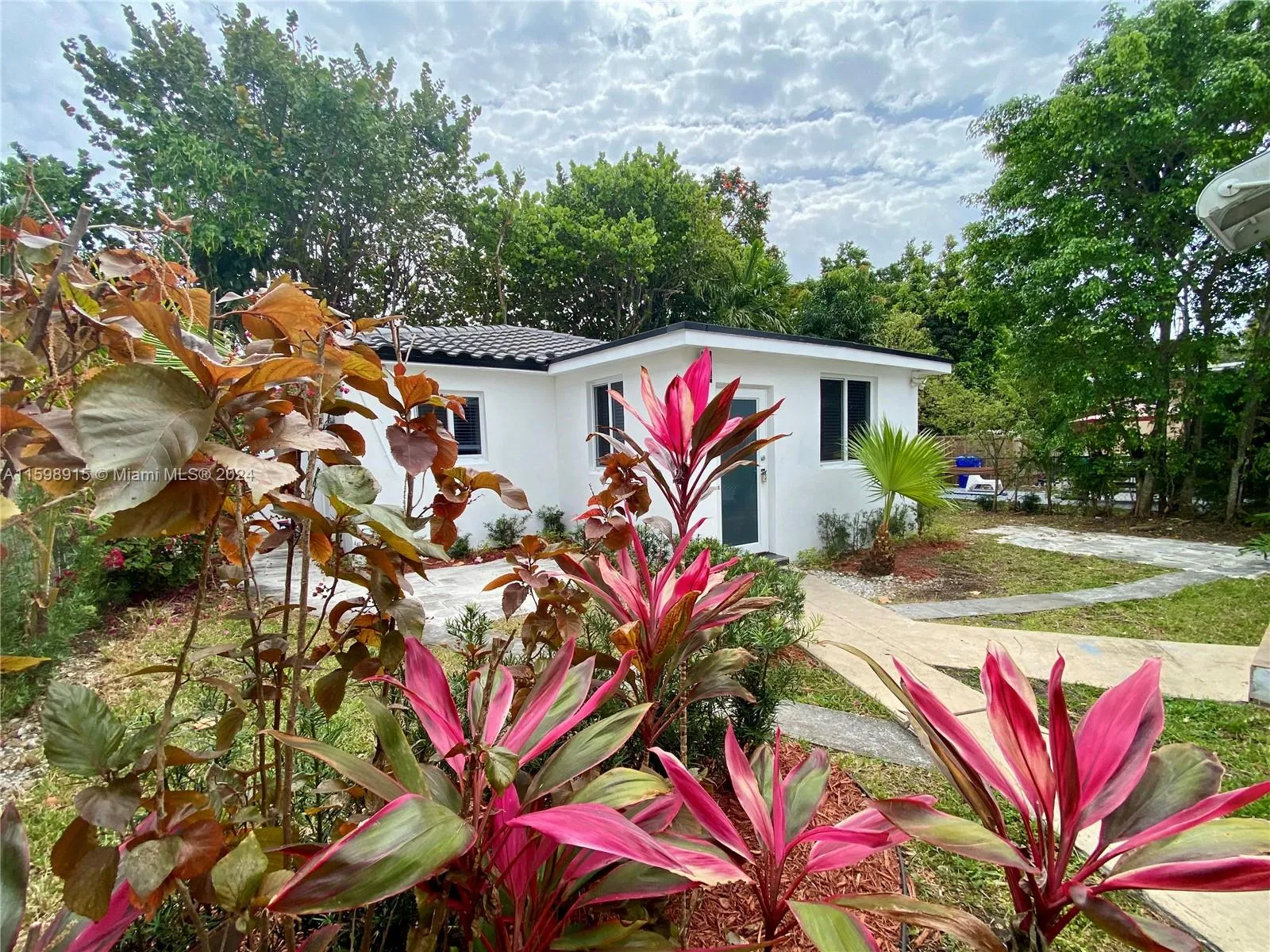 Glamorous  2 bedroom, 2 bath home with new gourmet kitchen and luxurious baths. Spacious great room and dining. Nice patio too. Great location. Steps to Coral Gables, Coconut Grove, Downtown, and Calle Ocho. New roof, impact windows, & more.