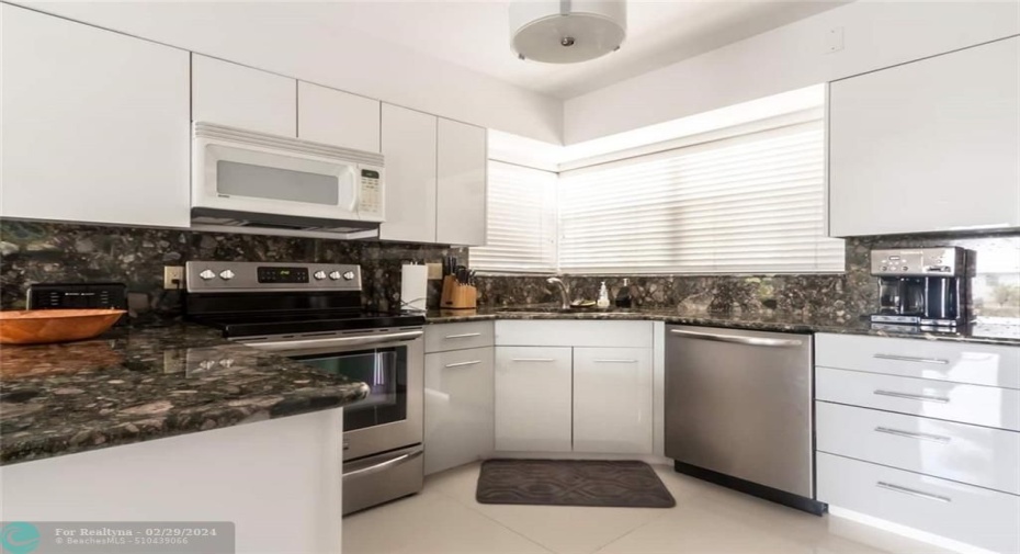 Kitchen which includes plates, glassware, pots/pans, utensils, refrigerator, ice maker, oven, microwave oven, toaster, regular drip coffee maker and much more!!