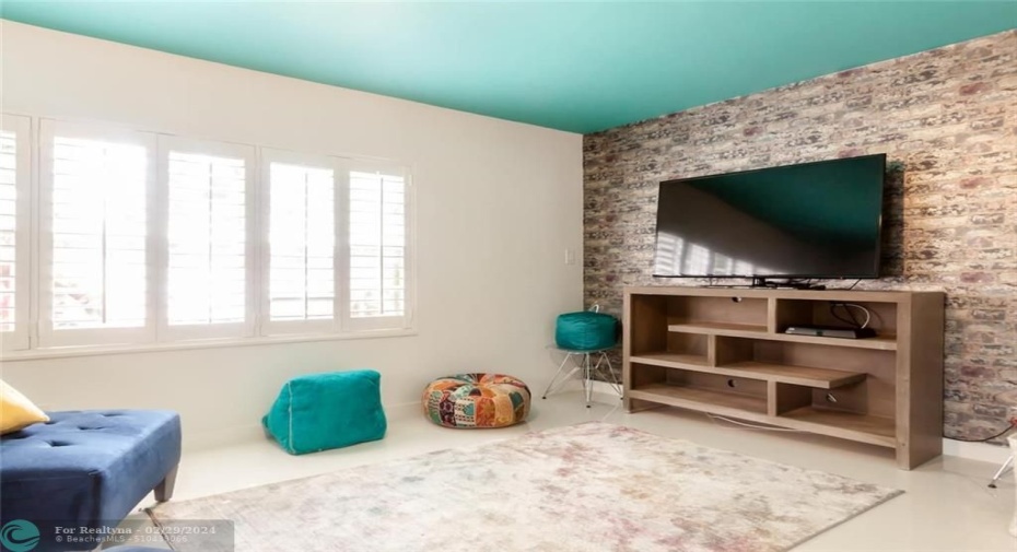 Bedroom #4/Media Room with 2 Twin Beds and Separate seating for gaming or movie night.